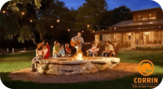 Kiln Dried Firewood in Phoenixville, PA - image of friends gathered around a fire in a beautiful backyard